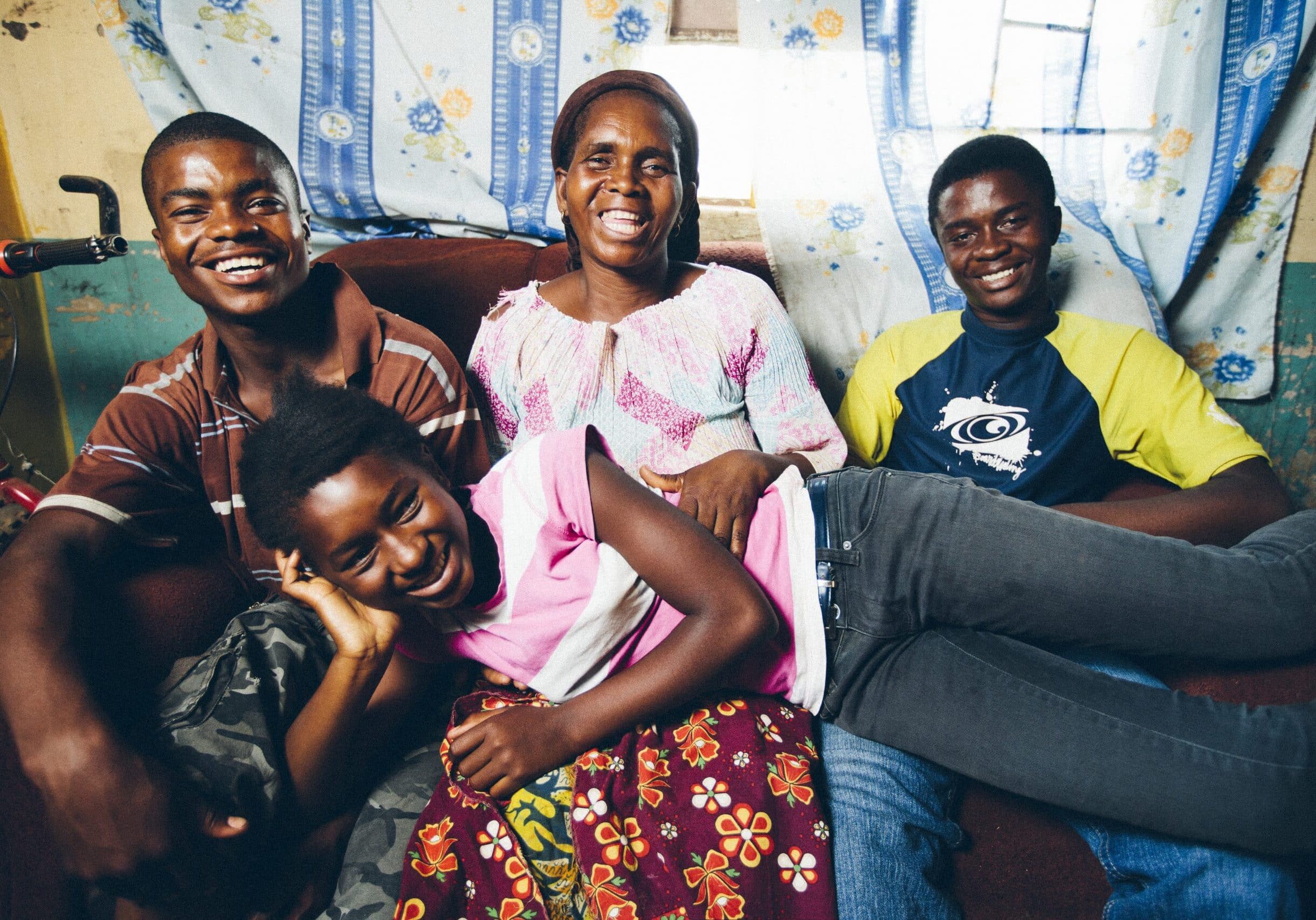 smiling family on sofa