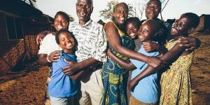 Peter-and-Teresa-and-kids-hugging1-300x200