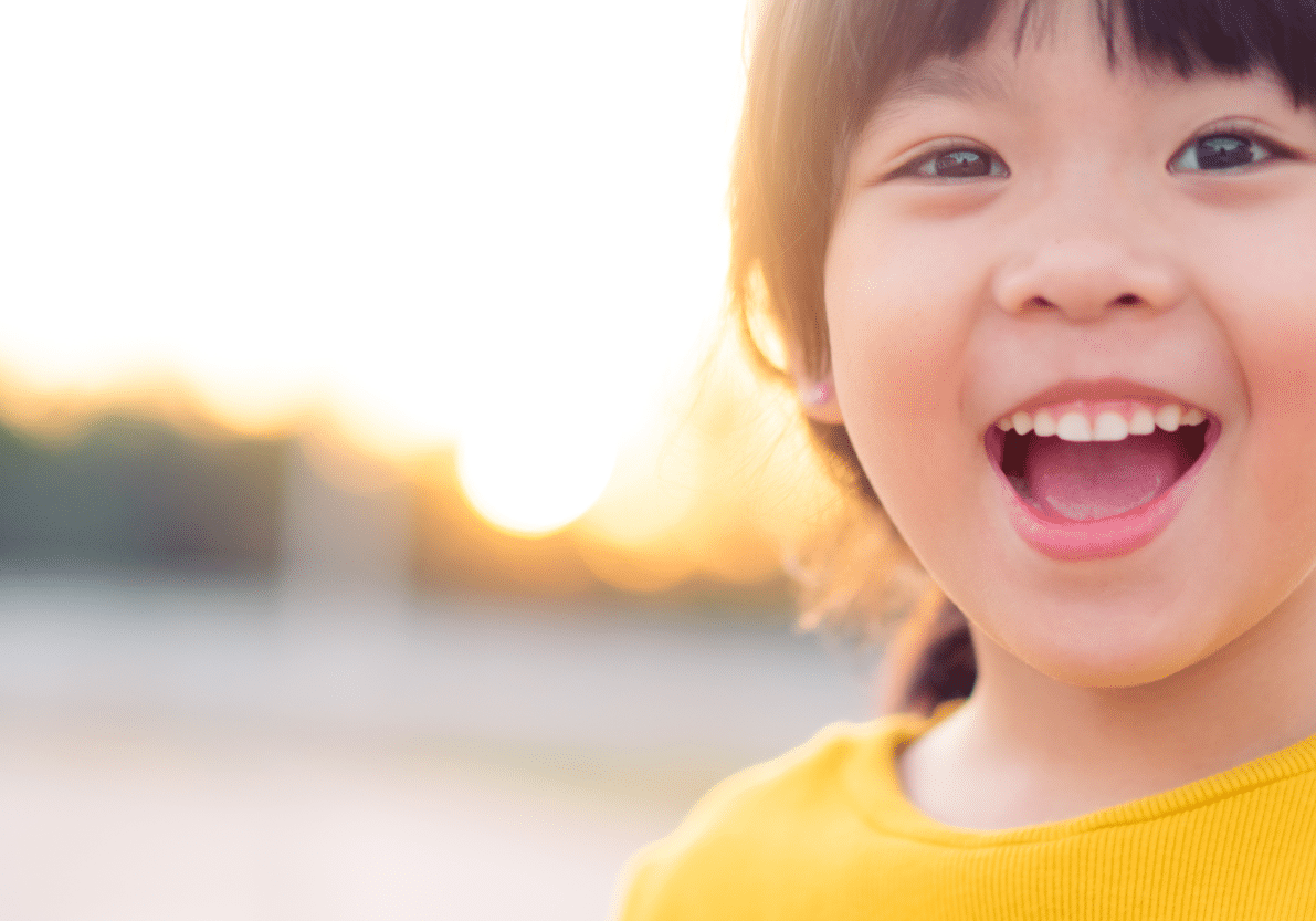 smiling girl wearing yellow